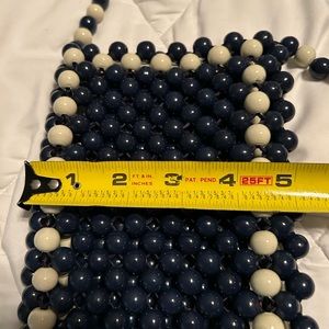 Tory Burch Blue & Cream hold cell phone. Good for a vacation. Never been used.